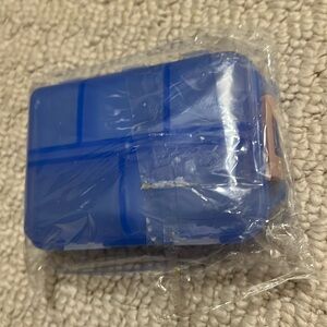 NWT - Pull organizer.  10 snap open and closed compartments.